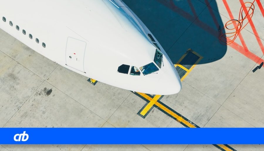 Aerial view of the airport. Airplane is preparation before take off.